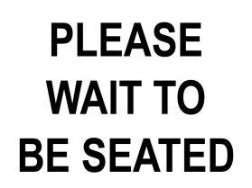 Please wait to be seated sign