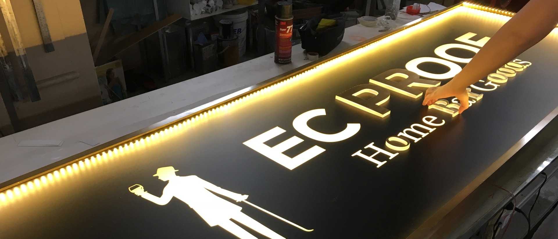 Bespoke brass lightbox with brass-faced 3D acrylic letters